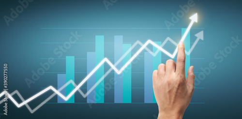 Hand touching a graphs of financial indicator accounting market economy analysis chart