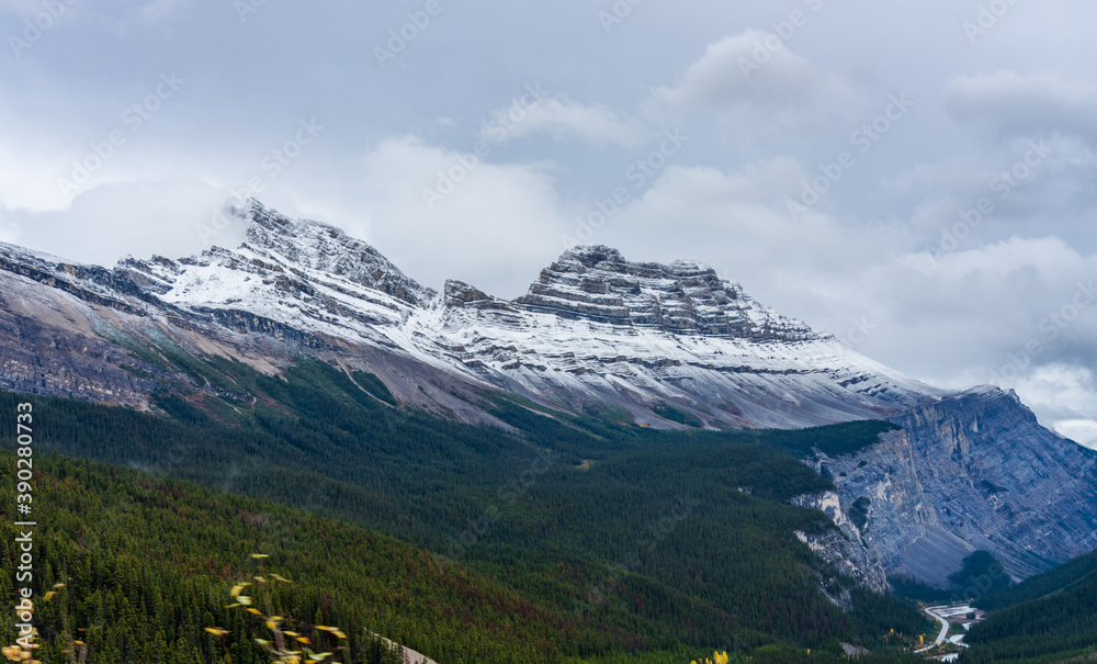 Snow-capped Cirrus Mountain in late autumn season. Seen from the Icefields Parkway (Alberta Highway 93), Jasper National Park, Canada.