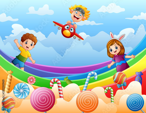 Happy kids playing on a candy land illustration