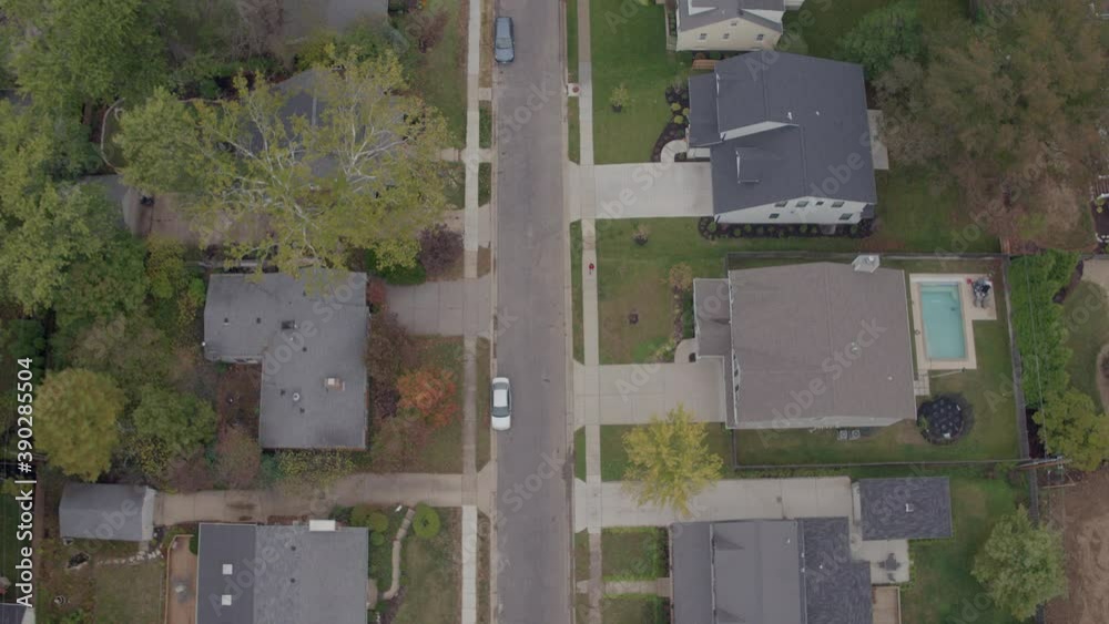 Overhead view of a suburban neighborhood in Autumn with a push up the street. Overhead view of a suburban neighborhood in Autumn with a push up the street.
