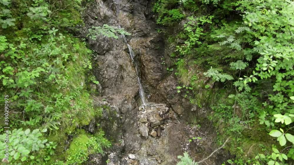 Water flowing down some rocks, waterfall, aerial drone shot, downwards movement, Slow Motion Water flowing down some rocks, waterfall, aerial drone shot, downwards movement, Slow Motion