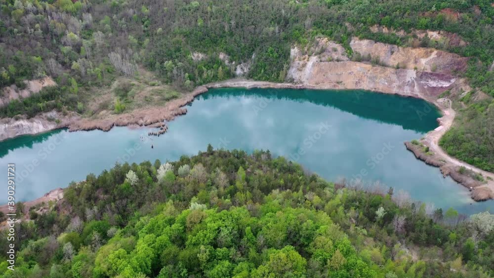 Mine quarry shot from above. Beautiful blue lake with white rocks. Location in hungary. Mine quarry shot from above. Beautiful blue lake with white rocks. Location in hungary.