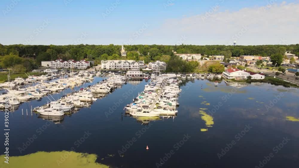 Drone flover of sailboats docked in a marina.
