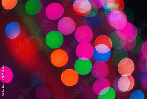 Festive background. Defocused images of colored circles.