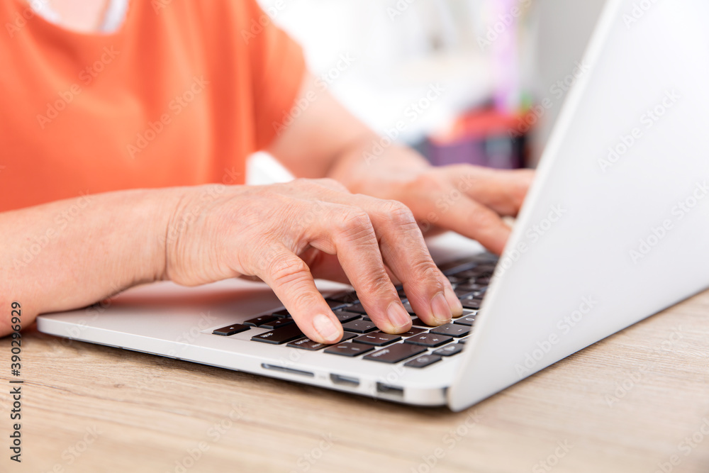 Old man's hand typing input on a computer keyboard Old man's hand typing input on a computer keyboard