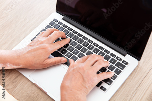 Принти на полотні Old man's hand typing input on a computer keyboard
