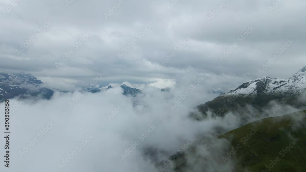 Clouds peacefully covering the Alpes. Dolly 4K 60fps drone shot. Clouds peacefully covering the Alpes. Dolly 4K 60fps drone shot.