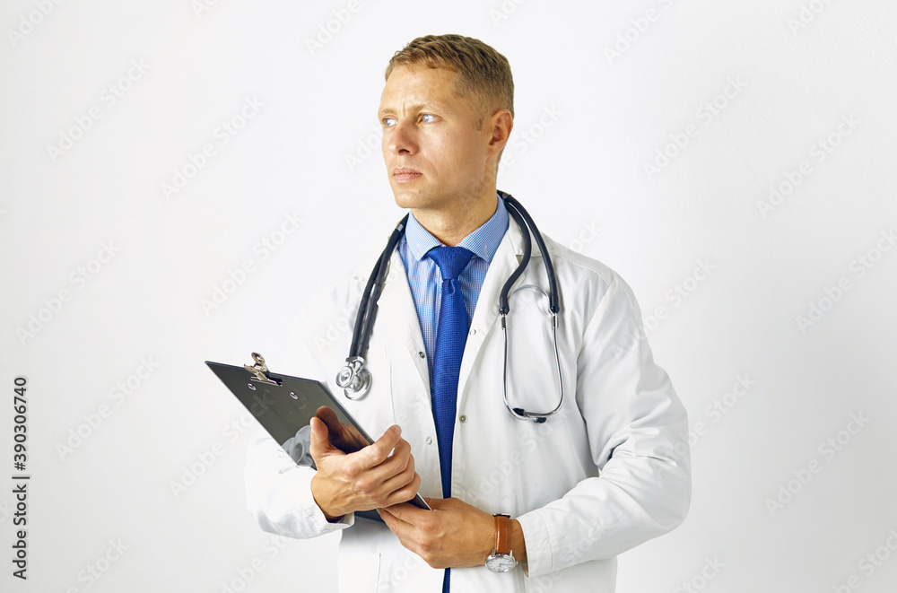 Young confident doctor in a white coat with a stethoscope Young confident doctor in a white coat with a stethoscope