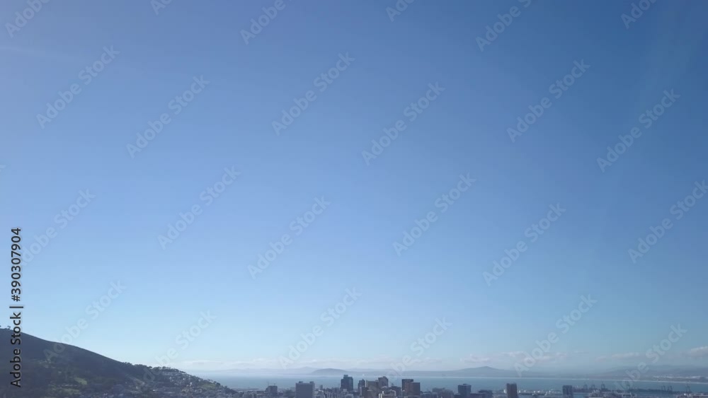 Aerial reveal of Cape Town city bowl jibbing up and tilting down with CBD. Aerial reveal of Cape Town city bowl jibbing up and tilting down with CBD.