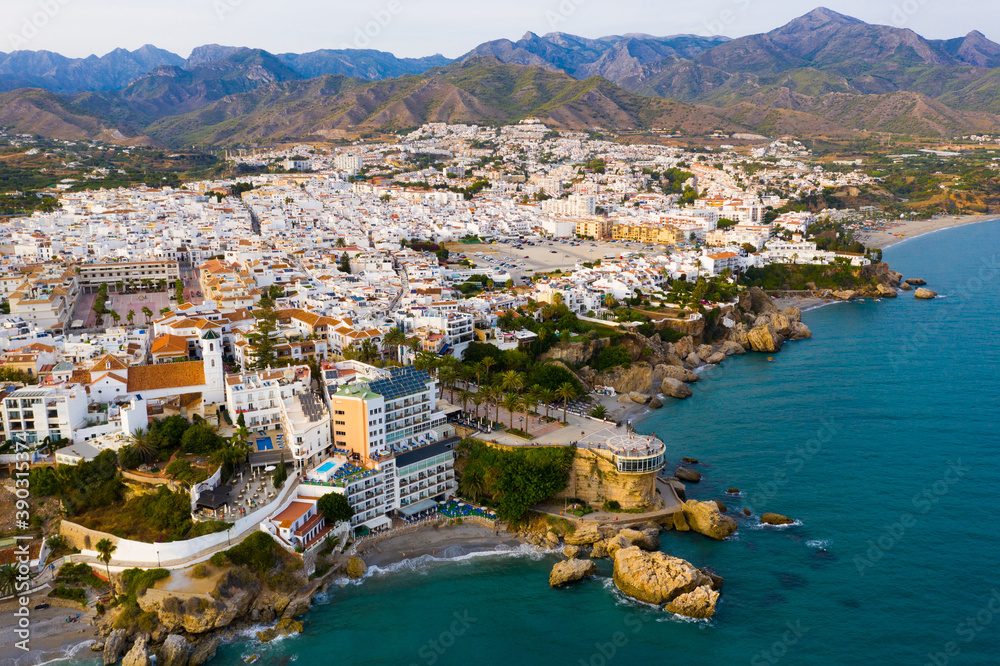Scenic aerial view of Spanish tourist city of Nerja on southern Mediterranean coast in sunny autumn day, province of Malaga.