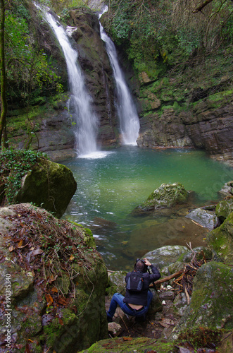 Carpinone - Molise - In a corner of unspoiled nature a photographer takes pictures of the small and suggestive waterfall photo