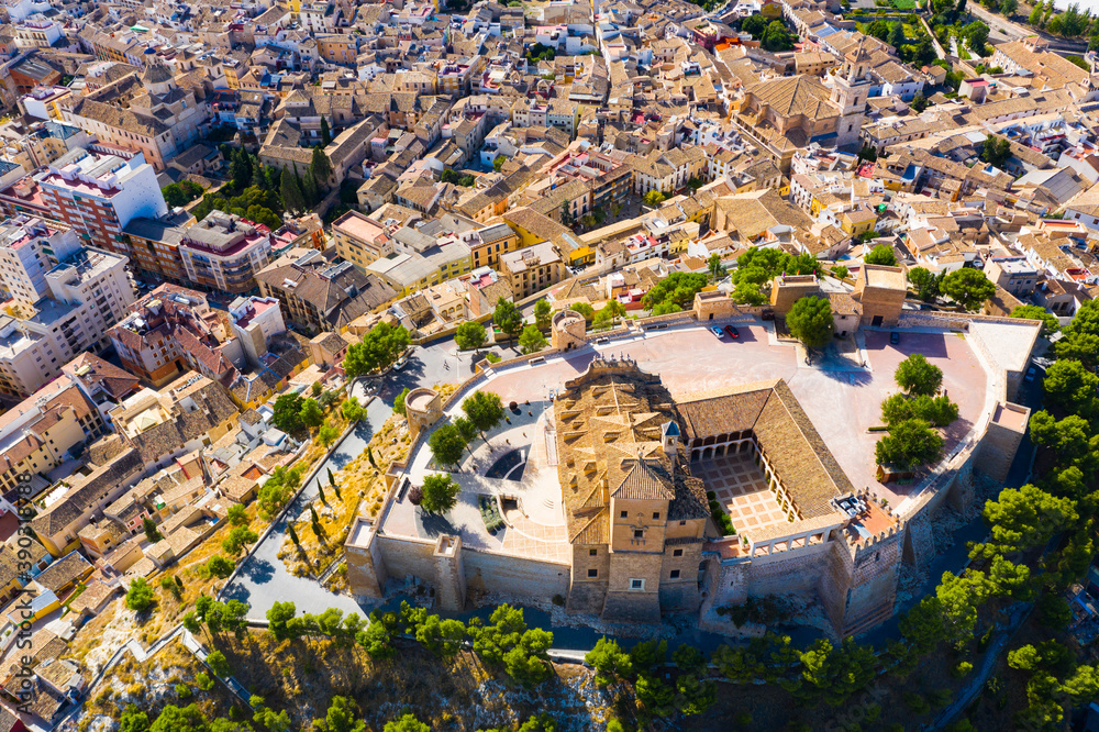 Fototapeta premium Aerial view of Caravaca de la Cruz cityscape with ancient fortified castle and Roman Catholic church, Spain