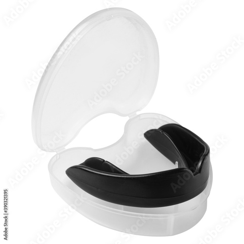 black boxing mouthguard, in a plastic container, protection of teeth and lips photo