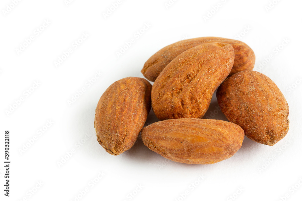 A pile of Almonds, isolated on a white background. A pile of Almonds, isolated on a white background.