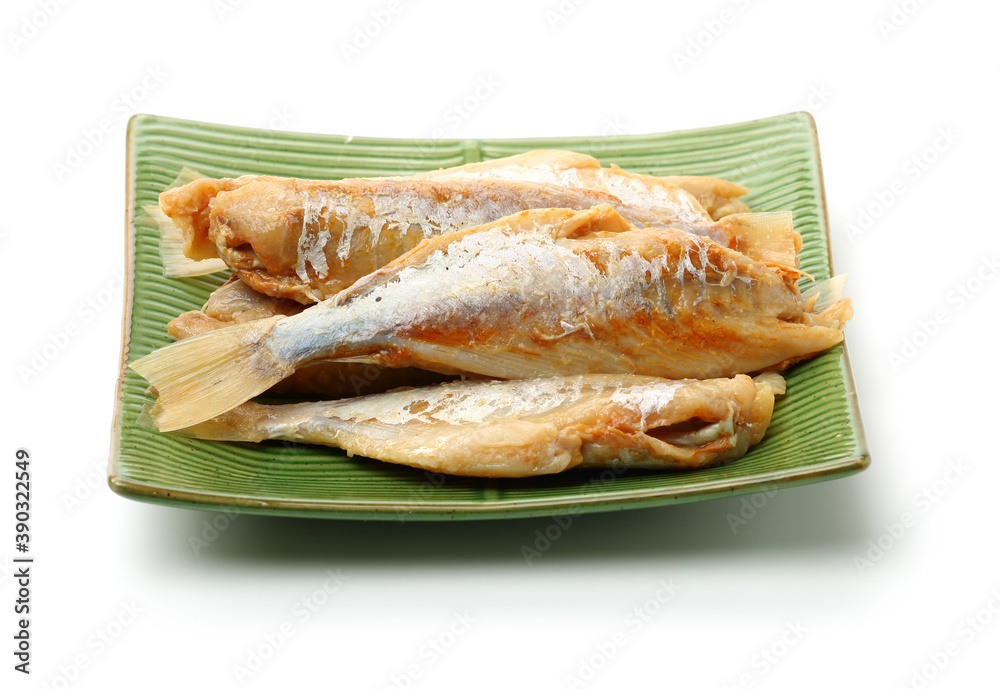 Dried salted fishes on white background Dried salted fishes on white background