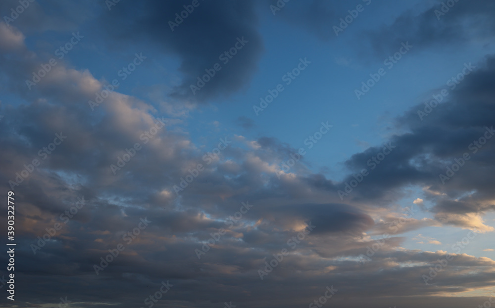 Beautiful sunset sky above clouds with dramatic light