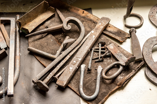 old rusty metal tools and pieces in a workshop