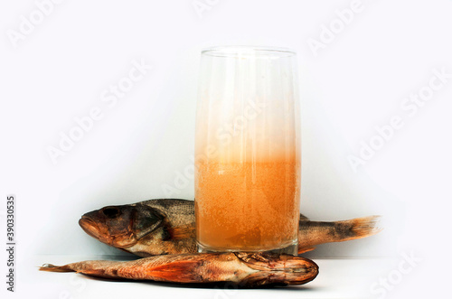 dried fish and a glass of beer