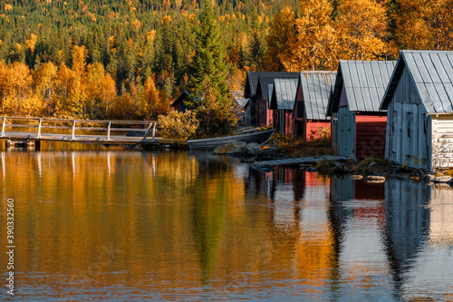Beautiful shot of boathouses in Autumn Fototapete