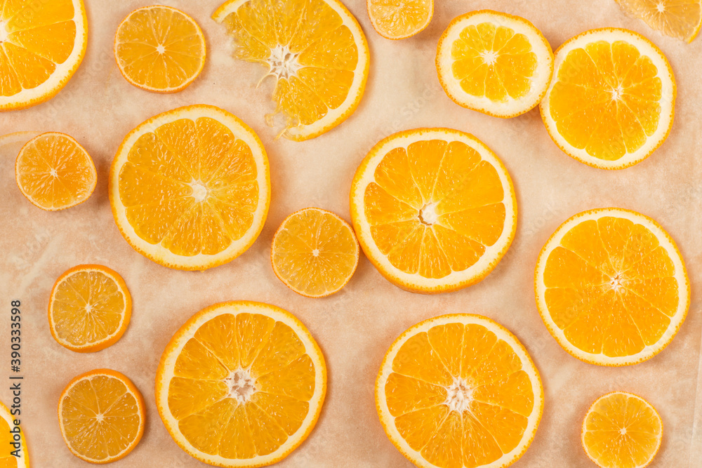 Round orange slices on a light background. Round orange slices on a light background.