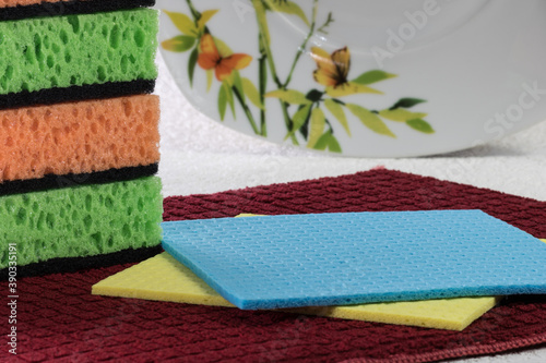 Kitchen sponges, cellulose dishwashing napkins and a dish