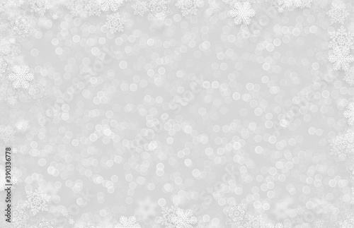 The winter background, falling snowflakes with bokeh
