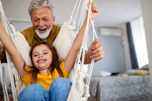 Family, generation love and people concept. Happy grandparent having fun with children at home