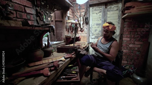 traditional manufacturing of keris handle at Terengganu malaysia with close up shot photo