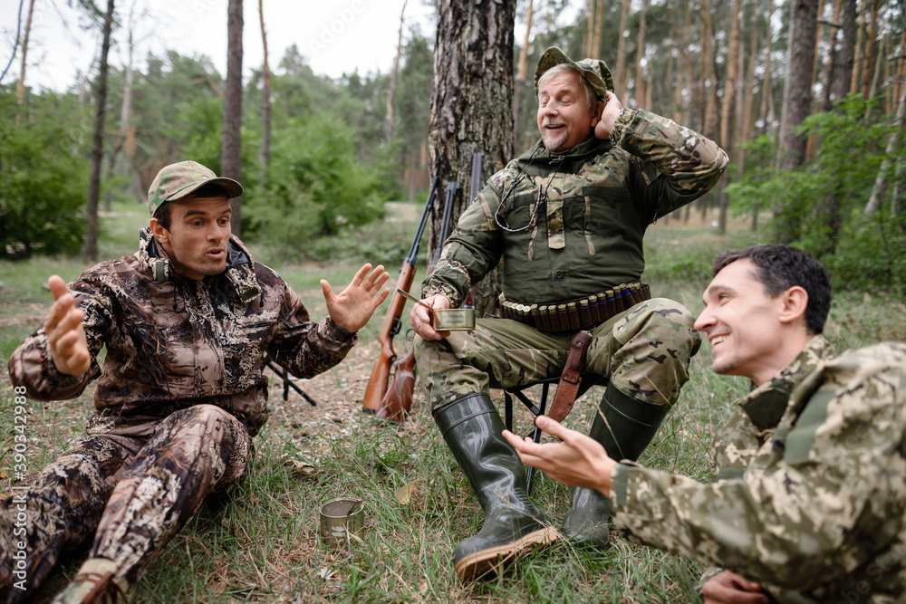 Drunk Hunters Have Picnic Telling Funny Story. Drunk Hunters Have Picnic Telling Funny Story.