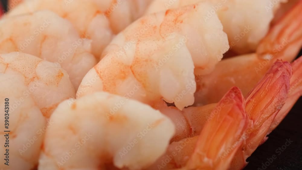 fresh shrimps close up on black plate fresh shrimps close up on black plate