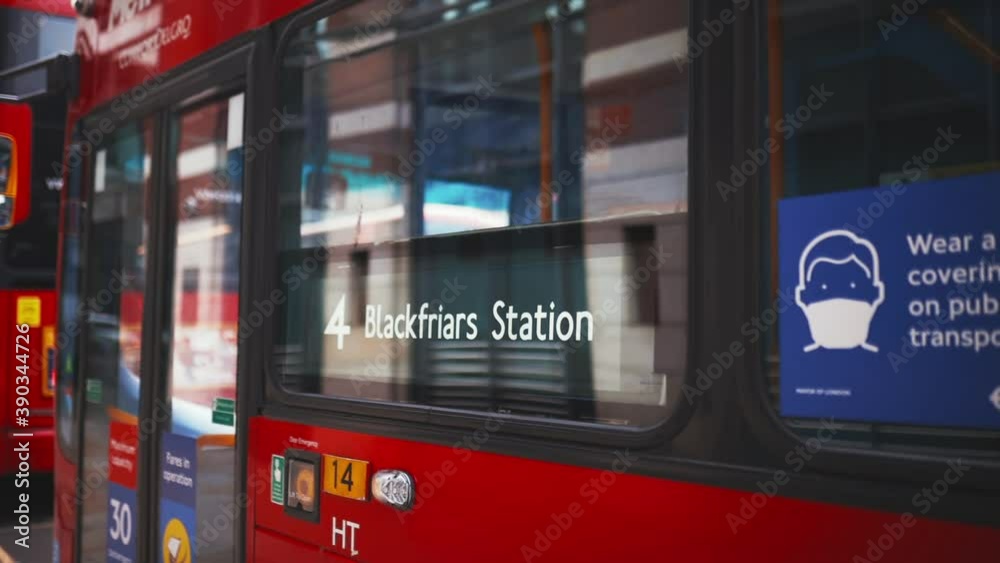 Blackfriars Station sign on the window of a classic red London bus