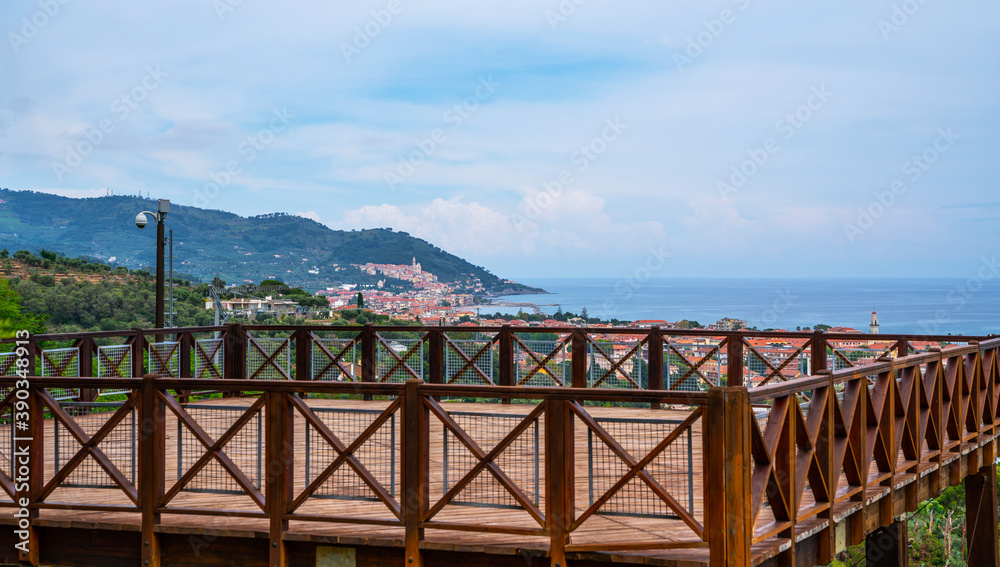 High view point on cliff platform overlooking sea and mediterranean coastline with cozy coastal towns.