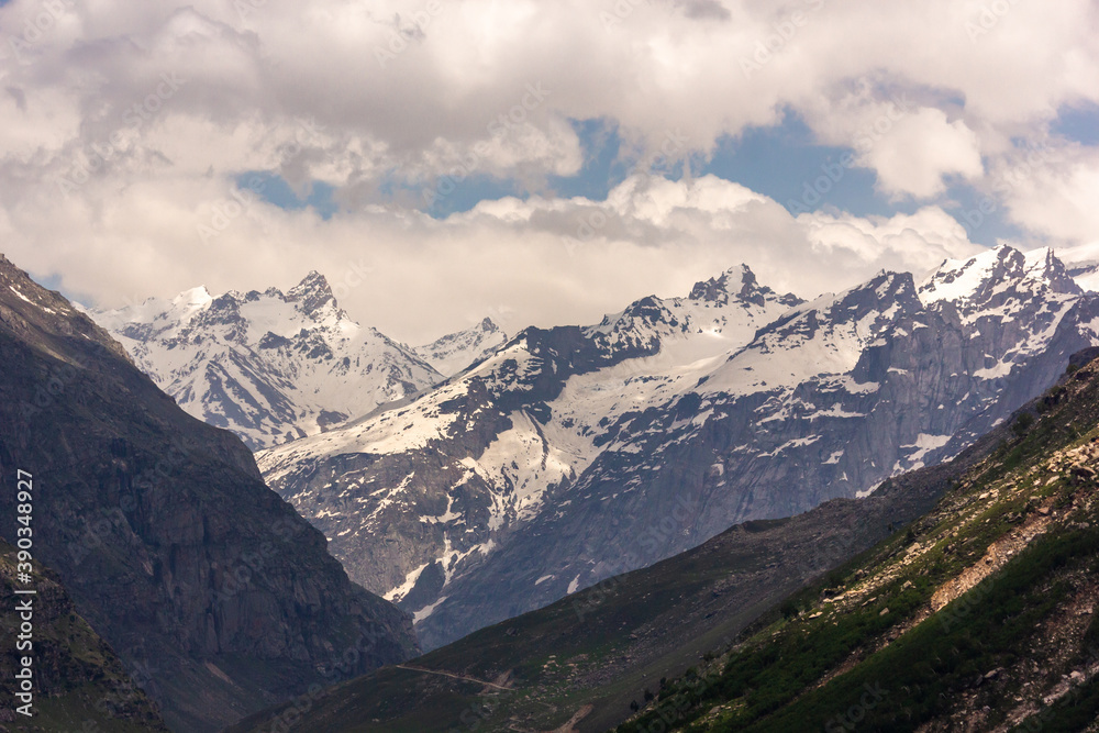 Scenic landscape of a snow capped Himalayan mountain range in the Lahaul district in the state of Himachal Pradesh in India.