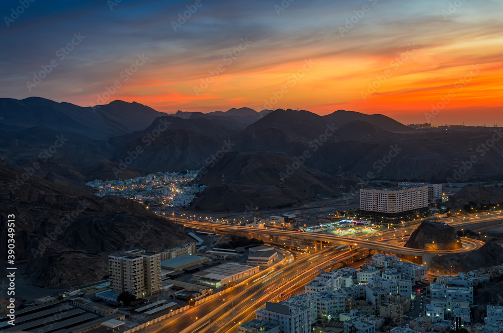 Beautiful Orange sky over Muscat city in the evening. Shot from a hilltop.