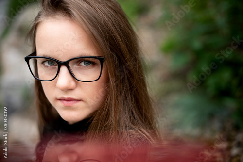 Portrait of a girl with glasses. Eye health thanks to glasses