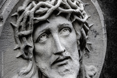 The face of Jesus Christ close up. Wreath of thorns and suffering
