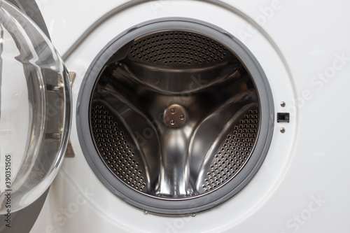 Open door in an empty washing machine.