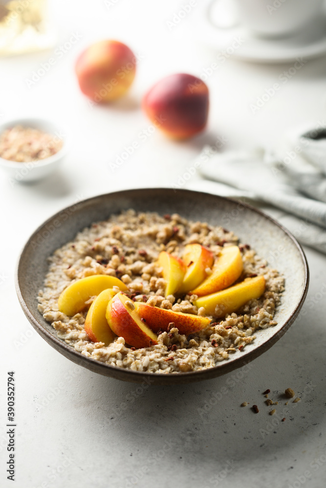 Healthy oatmeal porridge with fresh peach Healthy oatmeal porridge with fresh peach