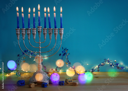 Religion image of jewish holiday Hanukkah background with menorah (traditional candelabra) and candles