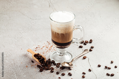 Coffee moccacino with chocolate in a glass mug photo