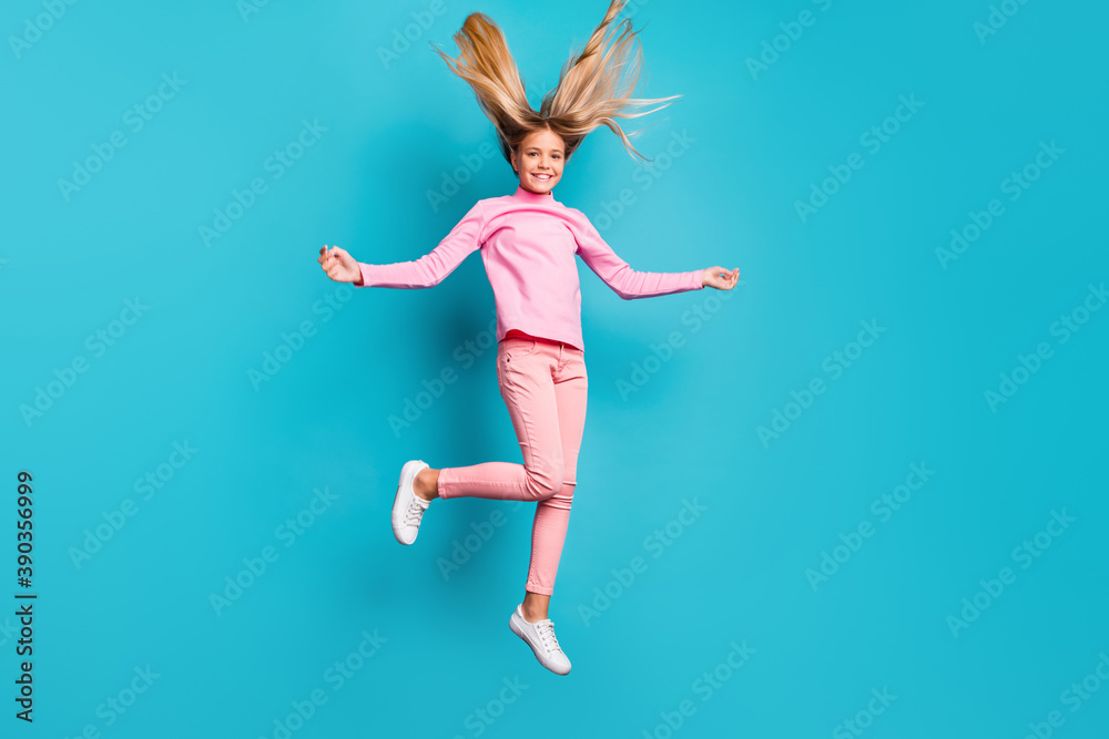 Obraz premium Full size photo of funny positive teenager jump hair up wear pink pants poloneck white footwear isolated on teal background
