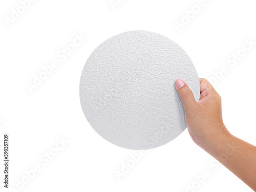 Hand holding styrofoam padding isolated on a white background
