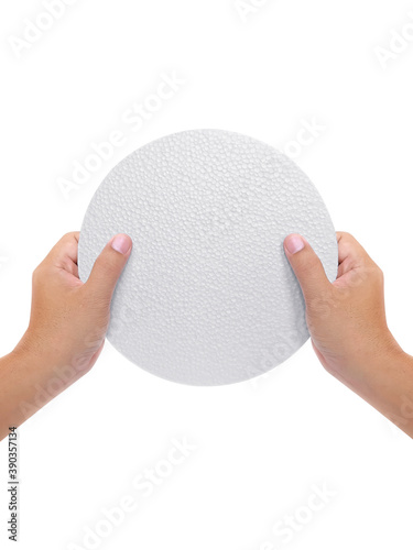 Hand holding styrofoam padding isolated on a white background