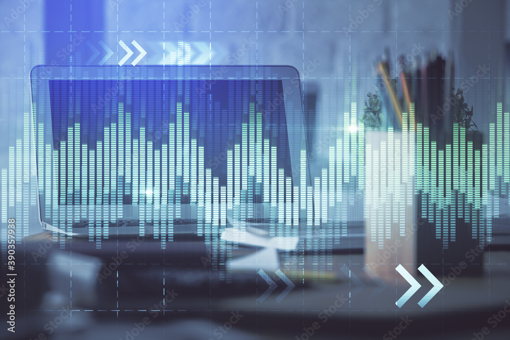 Stock market chart hologram drawn on personal computer background. Multi exposure. Concept of investment. Stock market chart hologram drawn on personal computer background. Multi exposure. Concept of investment.