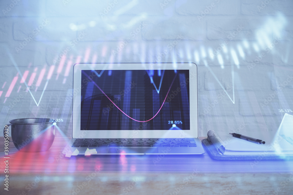 Forex Chart hologram on table with computer background. Double exposure. Concept of financial markets. Forex Chart hologram on table with computer background. Double exposure. Concept of financial markets.