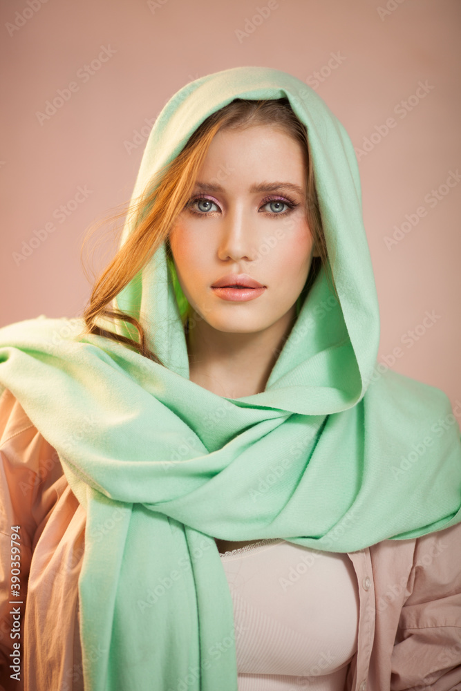 Portrait of a beautiful mysterious woman wearing a headscarf. Portrait of a beautiful mysterious woman wearing a headscarf.