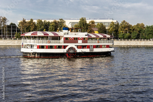 Double-deck pleasure ship with wheels on the sides.The design started the twentieth century. Photo for the site about tourism,travel,rivers and lakes.