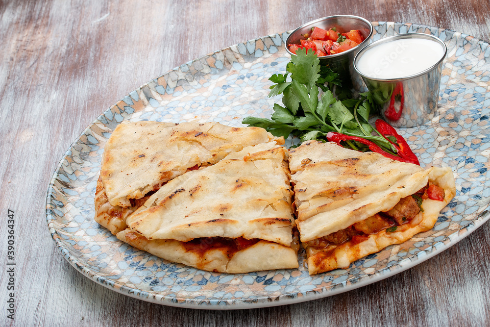 Quesadilla with сhicken, cheese and paprika. Traditional Mexican dish