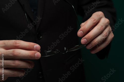 Man holding stylish glasses