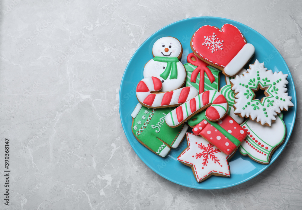 Delicious Christmas cookies on light marble table, top view. Space for text